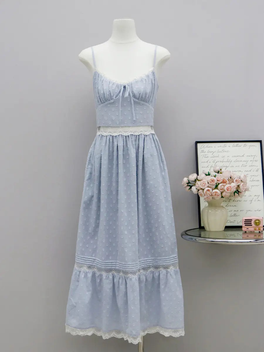 Aevoria pale blue polka dot maxi dress with white lace trim, featuring a tie-front sweetheart neckline, spaghetti straps, and a tiered skirt.
