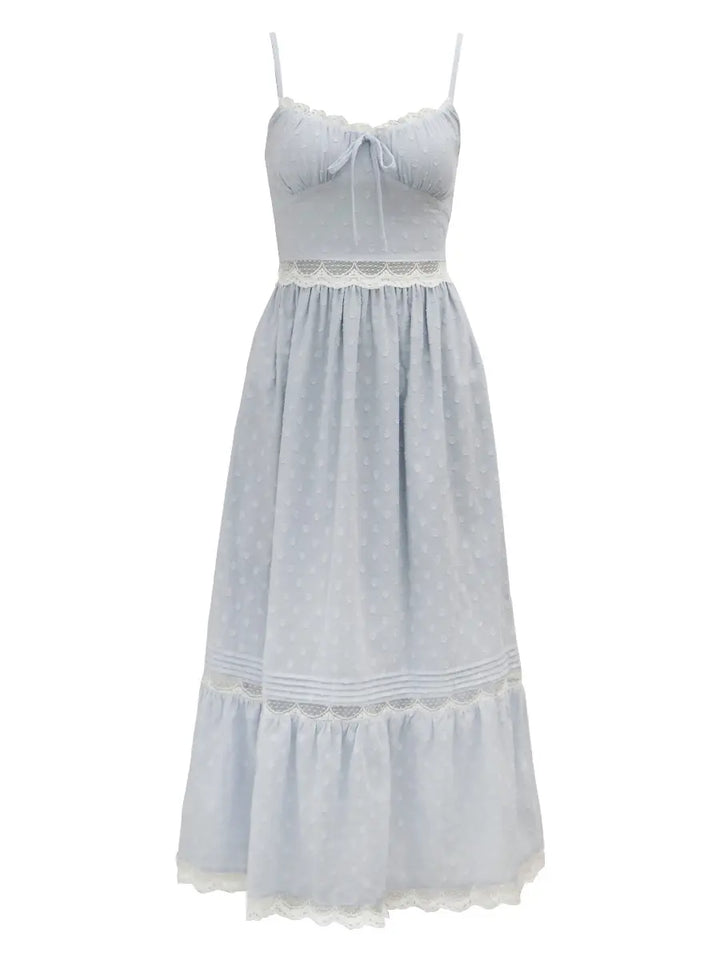 Pale blue polka dot maxi dress featuring delicate white lace trim along the neckline, waist, and hem, with adjustable spaghetti straps and a tie-front bodice.