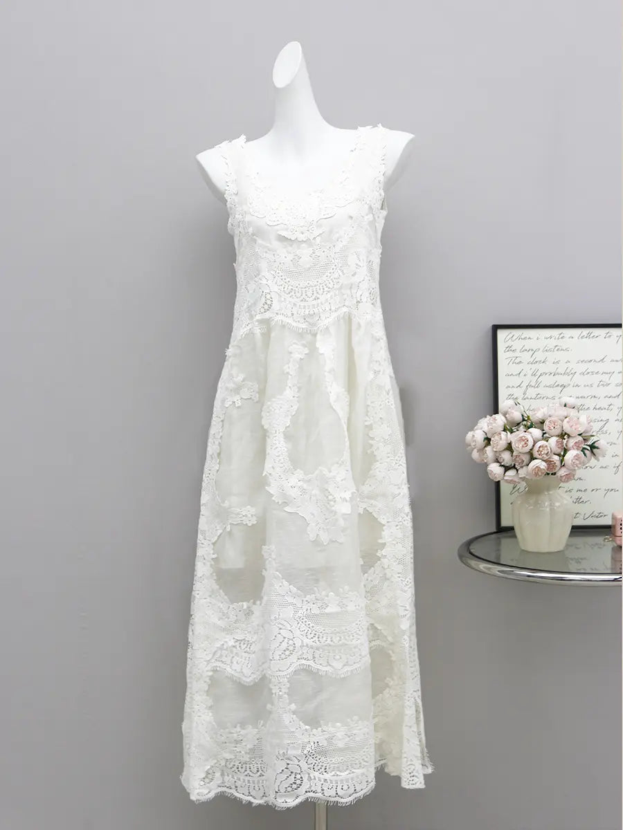 Shalok Ethereal Lace Maxi Dress in pure white, showcasing a sleeveless A-line silhouette with intricate floral water-soluble lace overlay and a delicately scalloped hem. Presented on a mannequin for a clear front view.